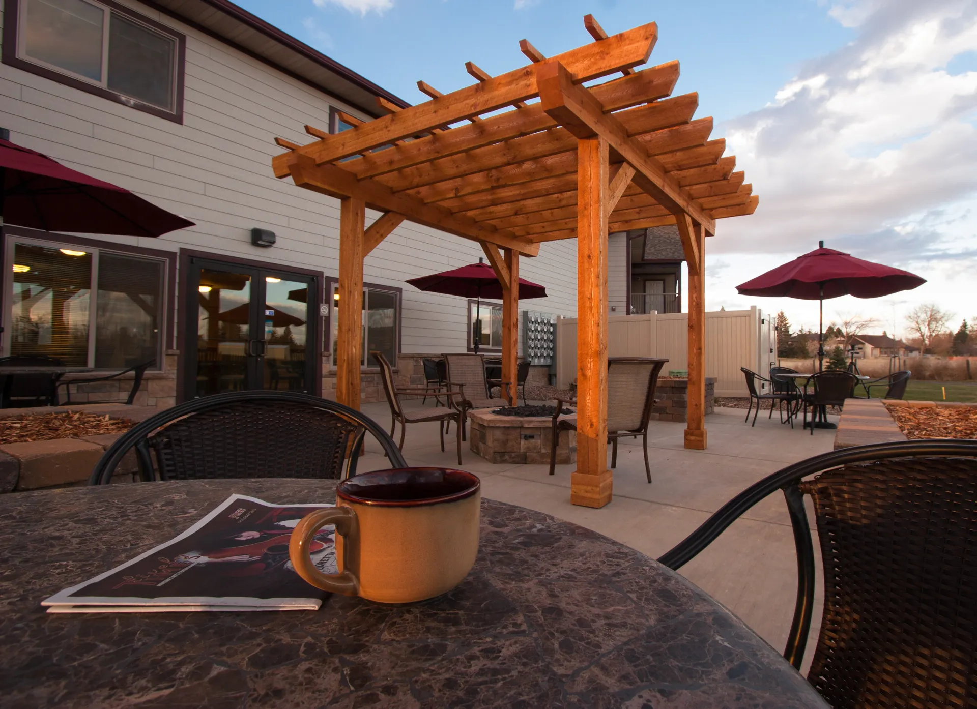 Outdoor pergola with seating area for relaxation and gatherings at CR Builders.