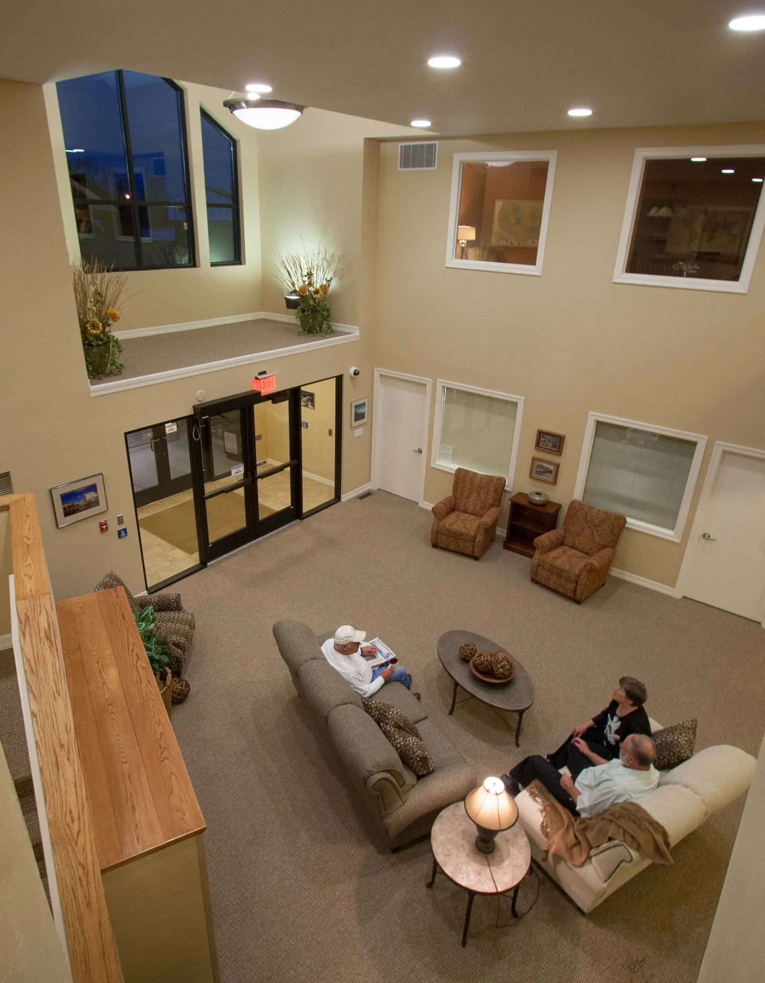 Modern lobby with cozy seating, large windows, and welcoming atmosphere for visitors.