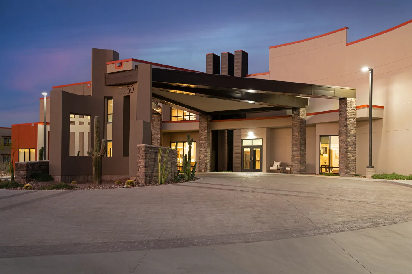 Modern commercial building with sleek entrance and contemporary architecture.
