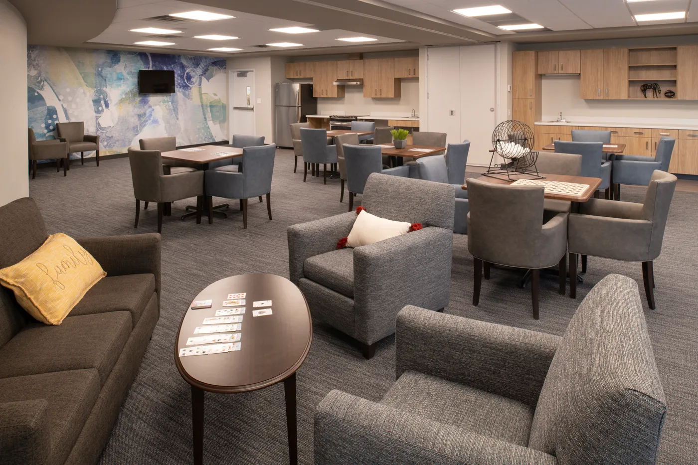Comfortable lounge with plush chairs, sofas, and modern decor for relaxation and socializing.