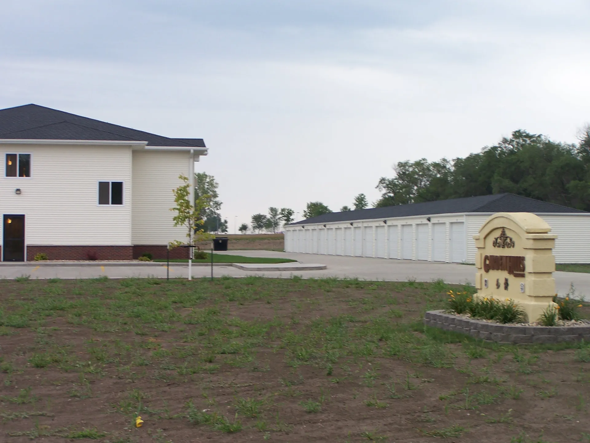 Residential property with large yard and storage units for versatile use.