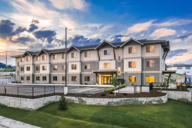 New residential apartment complex with multiple units and landscaped surroundings.