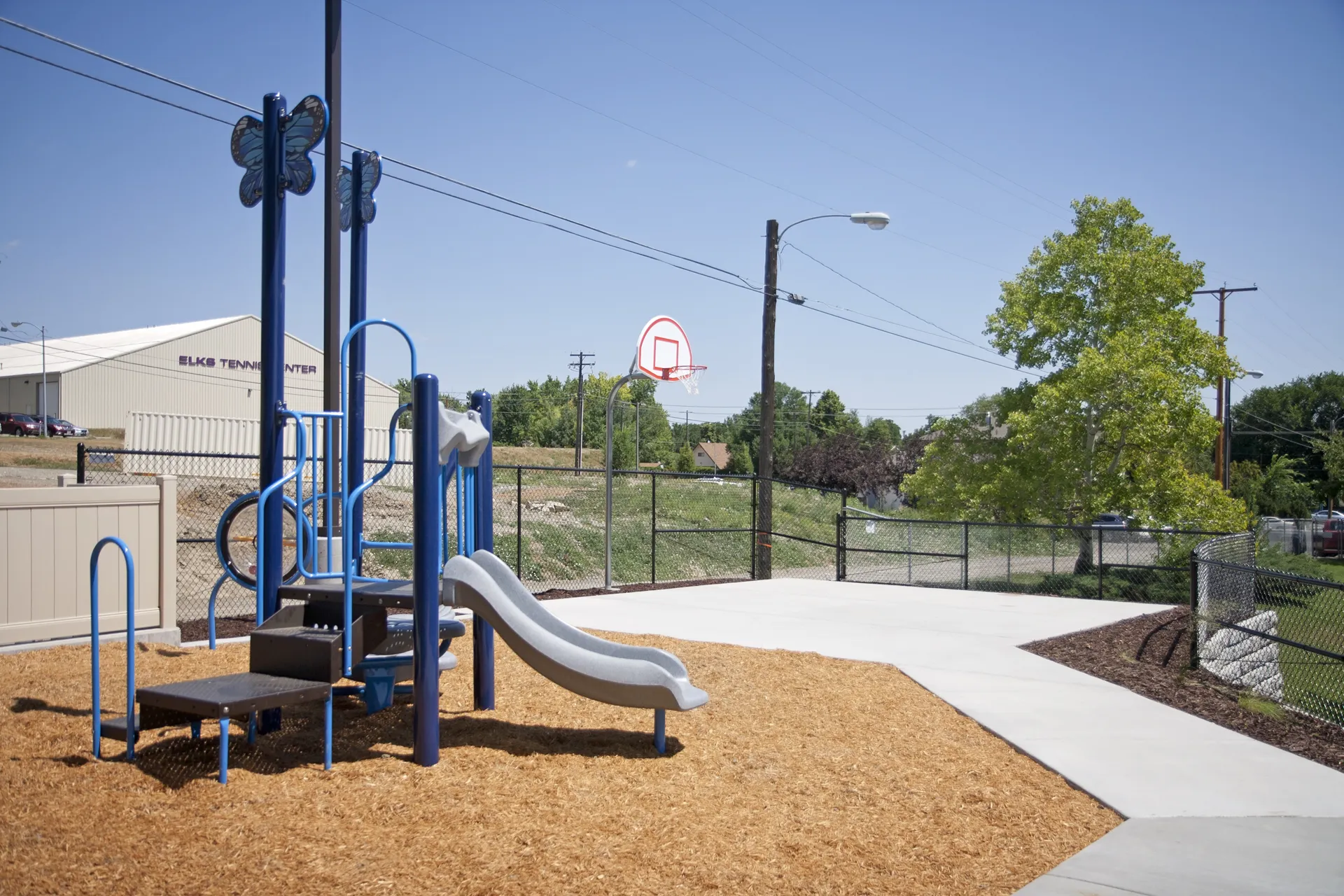 Playground with slides and climbing structures at CR Builders project site.