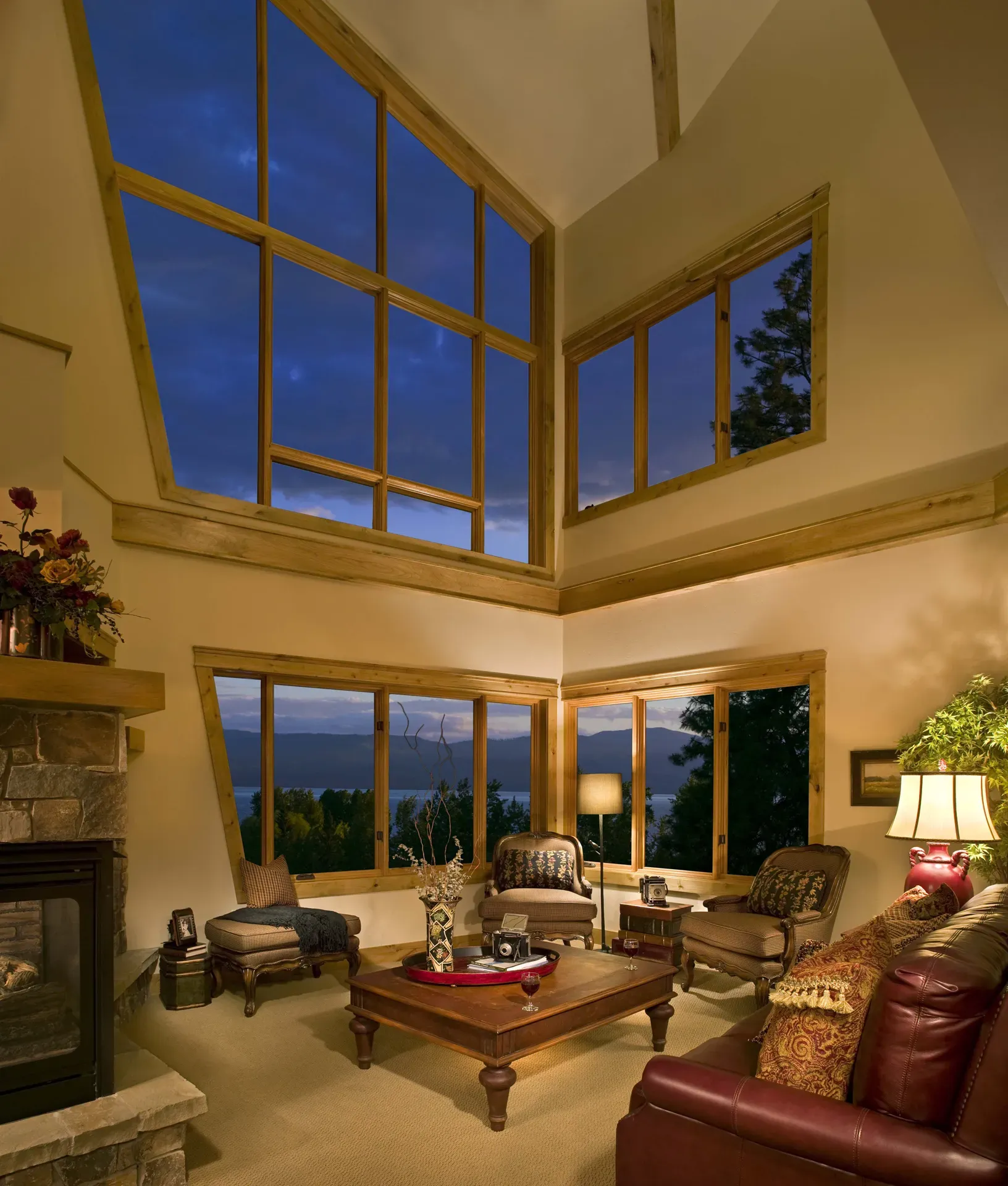 Spacious living room featuring expansive windows, high ceilings, and elegant furniture for a luxurio.
