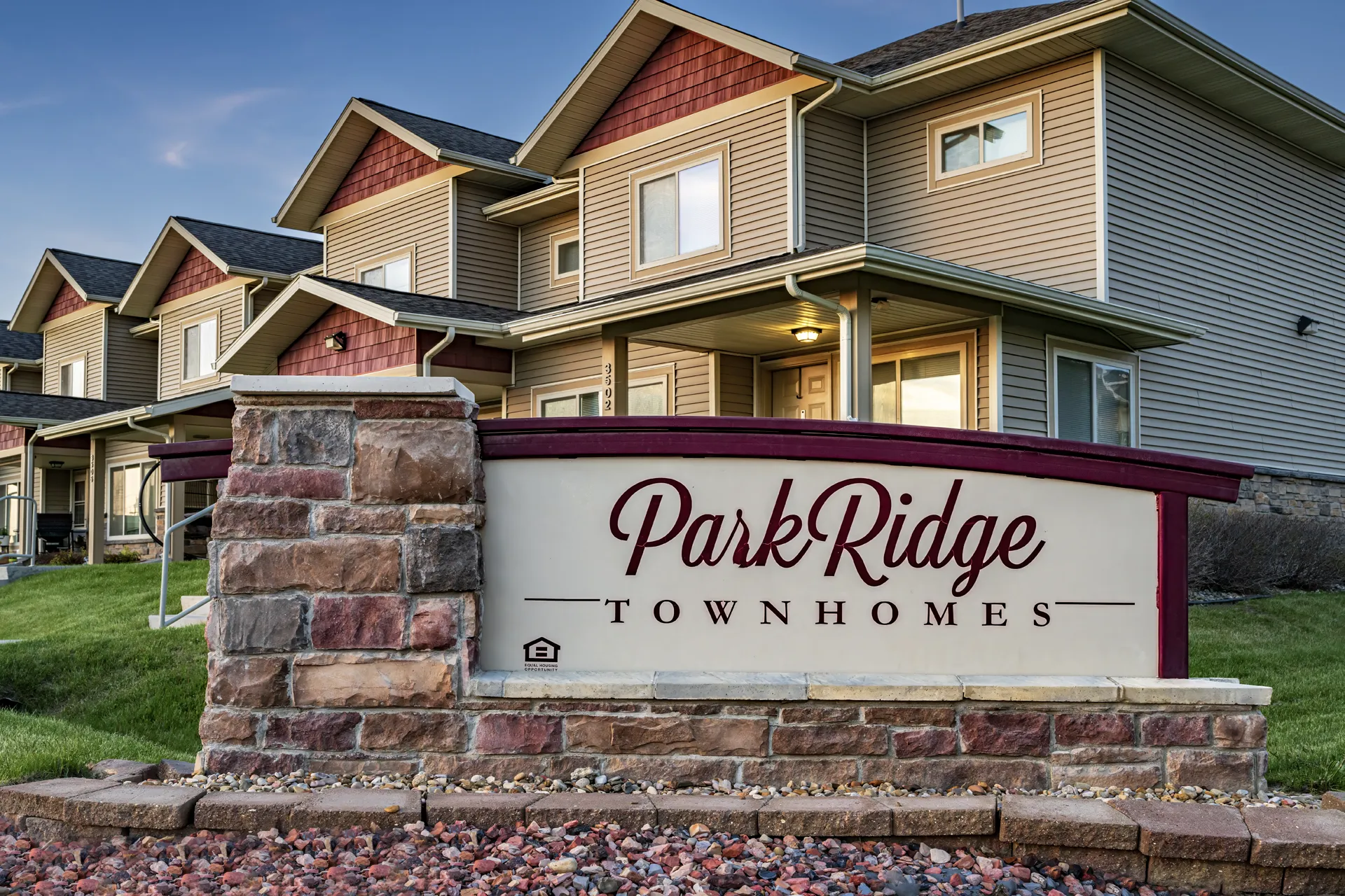 Elegant townhouse community with landscaped grounds and inviting exterior.