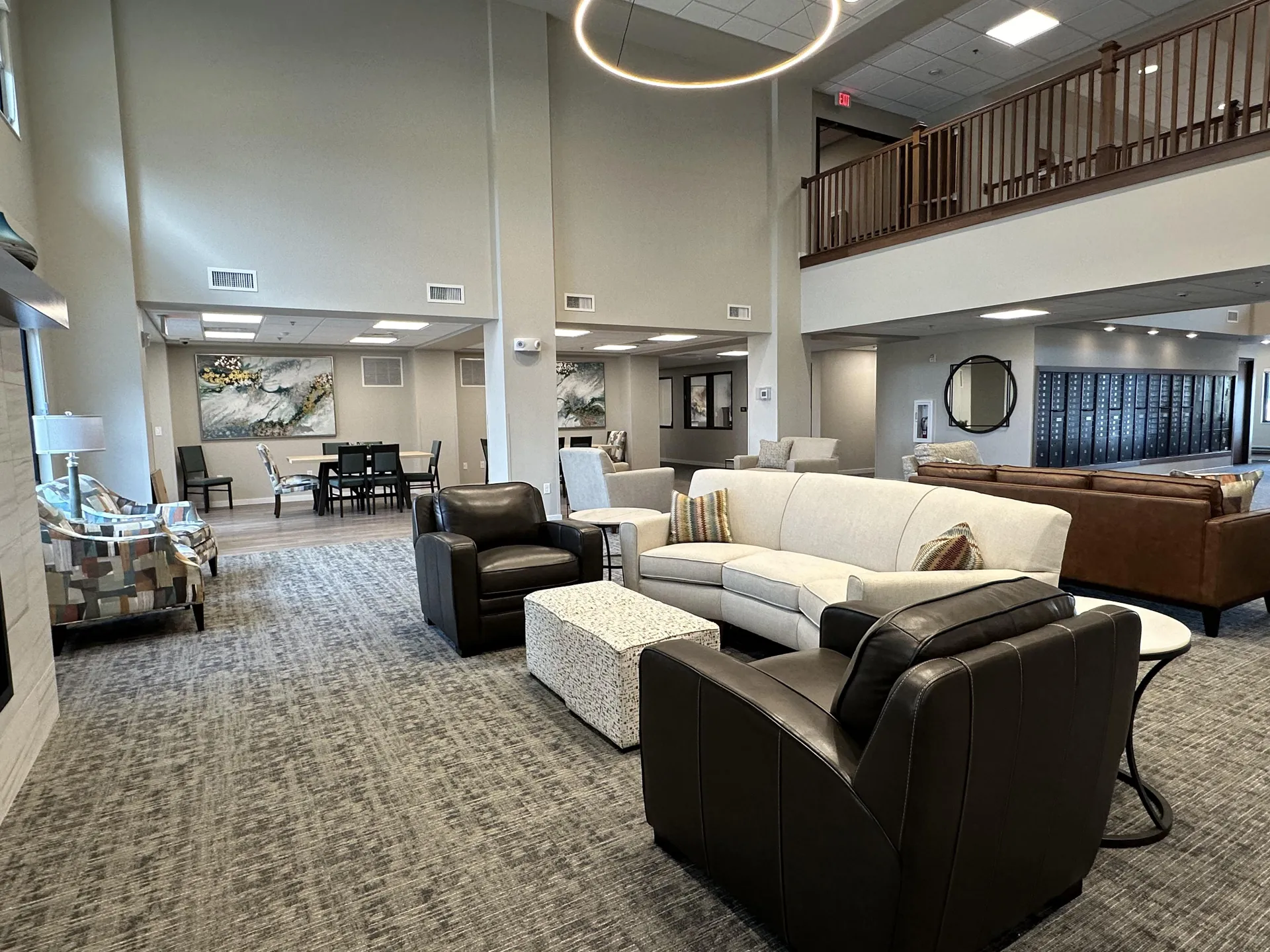 Elegant hotel lounge area featuring comfortable sofas and armchairs.