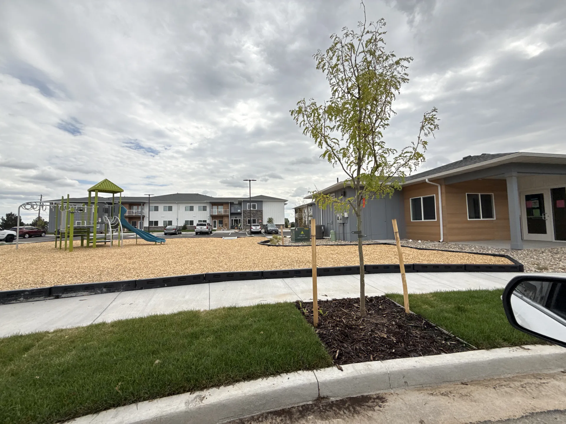 Beautiful neighborhood with new homes, trees, and outdoor amenities.