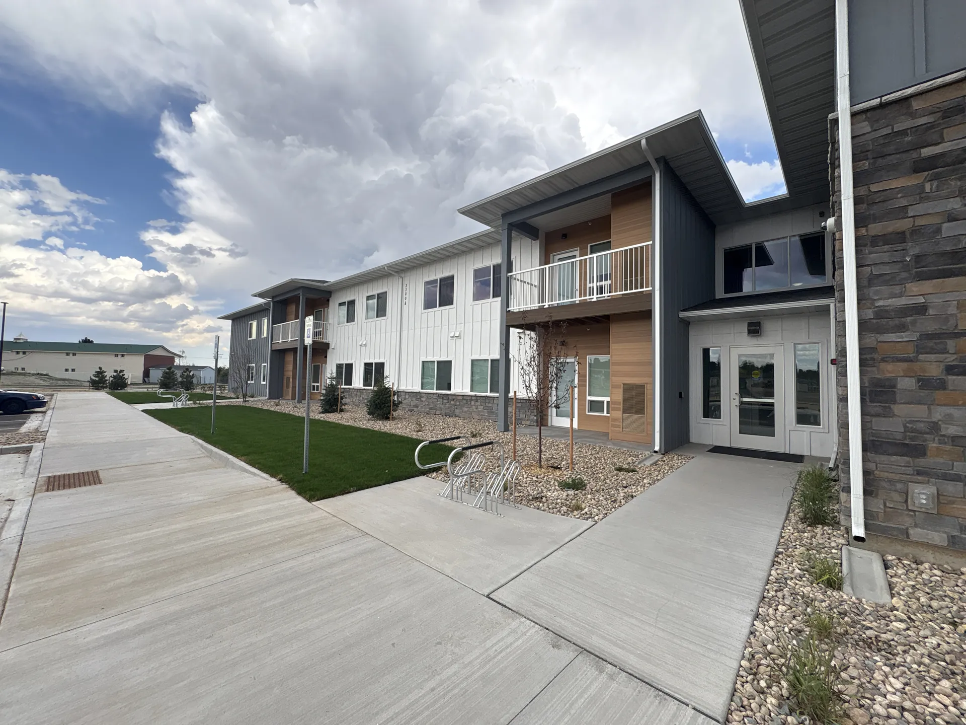 Modern multi-family residential building with contemporary design and clean exterior finishes.