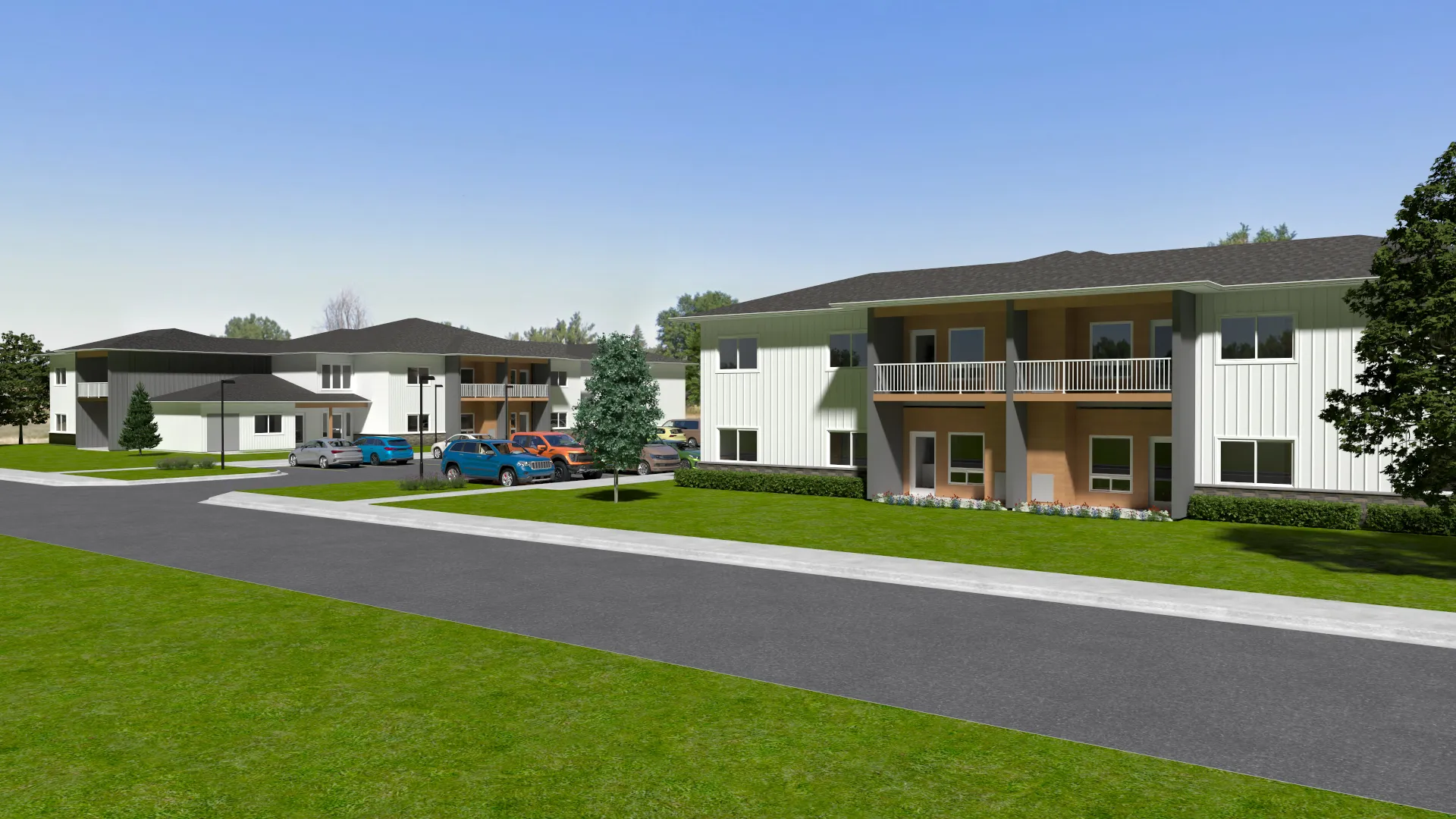 Contemporary apartment complex with landscaped surroundings and parking.