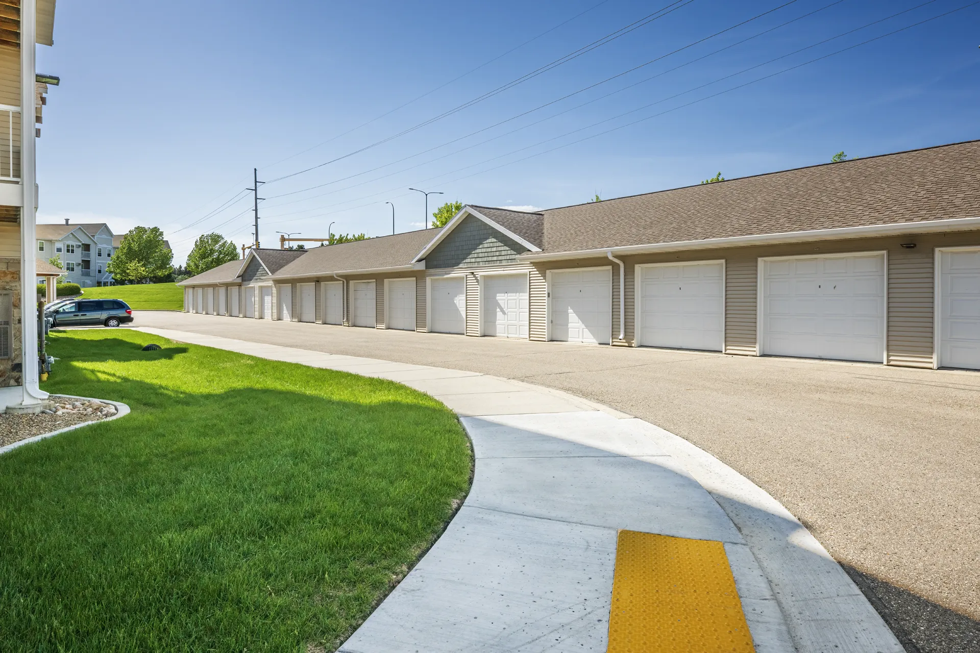 Garage storage units with white doors at CR Builders location.
